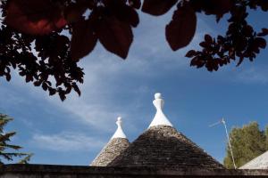 a roof of a building with two white spires at I trulli di Kate in Monopoli