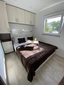 Postel nebo postele na pokoji v ubytování Mobile home Fran