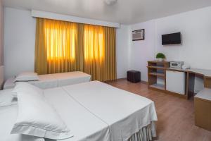 Postel nebo postele na pokoji v ubytování Hotel Torre Sol