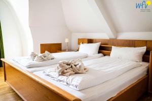 Кровать или кровати в номере Haus Lilo Ferienwohnung Frieda