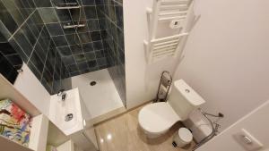 a small bathroom with a white toilet and a sink at PENTHOUSE MAJESTIC, MC, Bnbrickeys in Monte Carlo +12 photos