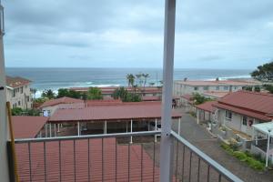 a view of the ocean from a balcony at Driftsands Sea View Flats in Uvongo Beach