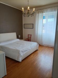 Ein Bett oder Betten in einem Zimmer der Unterkunft Casa Vacanze Litoranea
