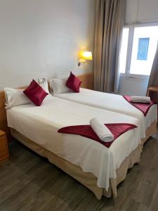 Postel nebo postele na pokoji v ubytování Hotel Norai