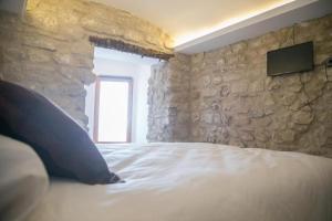 Cama o camas de una habitación en Apartamentos Turísticos La Casa Vieja
