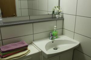 a bathroom with a sink and a mirror at Fox Hotel in Reykjavík