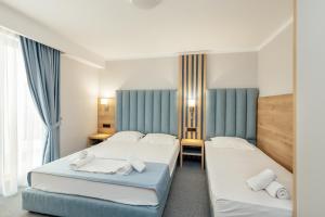 Postel nebo postele na pokoji v ubytování HOTEL TALIA