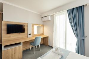 TV a/nebo společenská místnost v ubytování HOTEL TALIA