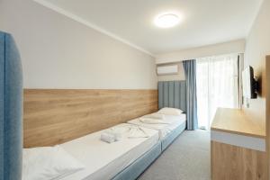 Postel nebo postele na pokoji v ubytování HOTEL TALIA