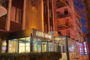 a building with a sign that reads kaza hotel at Alfin Hotel in Ankara