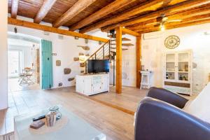 a living room with a couch and a table at Holiday house with a swimming pool - Villa Melavita in Stari Grad