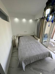 Кровать или кровати в номере DOMINA CORAL BAY HAREM