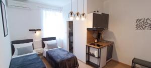 Posteľ alebo postele v izbe v ubytovaní Rooms Diana