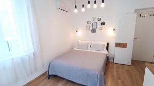 Posteľ alebo postele v izbe v ubytovaní Rooms Diana