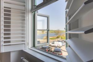 a window in a building with a view of a parking lot at Start Way in Kingsbridge