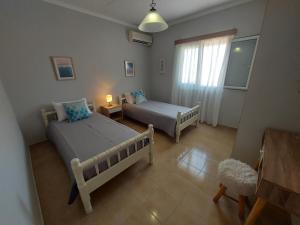 Katil atau katil-katil dalam bilik di Meliti Villa