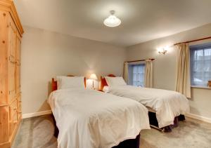 Ένα ή περισσότερα κρεβάτια σε δωμάτιο στο Barn Owl Cottage