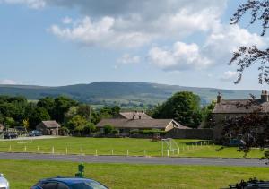 a view of a park with a house and a road at Upper Cherry Bank in Bainbridge