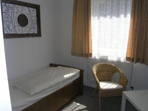 Postel nebo postele na pokoji v ubytování Gasthof am See