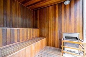 an empty wooden sauna with a stove in it at Tabas - VN Ferreira Lobo in São Paulo