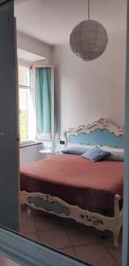 Postel nebo postele na pokoji v ubytování La Casetta del Bianconiglio by SMART-HOME