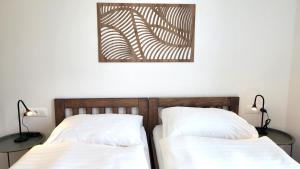 Postel nebo postele na pokoji v ubytování Apartmány U stezek
