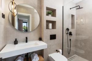 a bathroom with a sink and a mirror at A'more Bijeca - 20m from the beach - NEW & MODERN - 2023 in Medulin