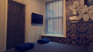 TV a/nebo společenská místnost v ubytování Urban Inn + 2 fotografie