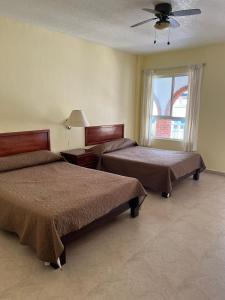 Postel nebo postele na pokoji v ubytování Hotel El Romano