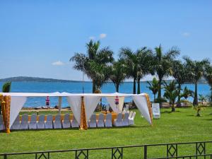 a set up for a wedding on the beach at VICTORIA SANDS LODGE in Mbita