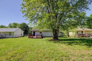a yard with a tree and a house at Beautiful home in a nice place in Clarksville