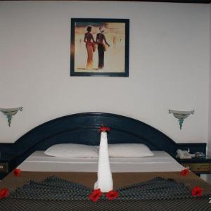 a bedroom with a bed with a christmas tree on it at chalets Mirage beach in Hurghada