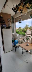 a kitchen with a table and a large window at EL RINCON DORADO in Melilla