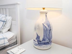 a blue and white vase sitting on a table at Navigators Rest in Whitby