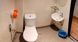 a bathroom with a toilet and a sink at MILAN HOTEL in Johor Bahru