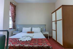 Postel nebo postele na pokoji v ubytování OttomanZade