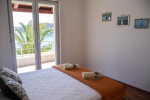 Ένα ή περισσότερα κρεβάτια σε δωμάτιο στο Apartman Klara