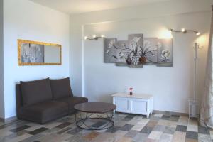 a living room with a couch and a table at Don Vittorio Country Village in Taormina