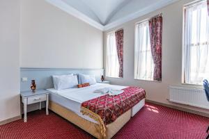 Postel nebo postele na pokoji v ubytování OttomanZade