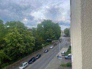 a view of a street with cars parked on the road at Boutique Zimmer Privat 1-4 Personen in Frankfurt/Main