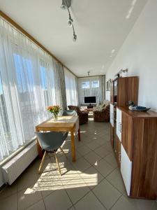 a kitchen with a table and a living room at Rosenhof in Binz in Binz