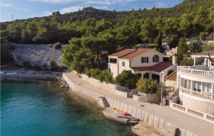 arial view of a river with houses and buildings at Stunning Home In Klek With Sauna in Klek