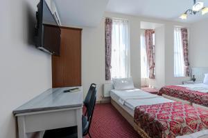 Postel nebo postele na pokoji v ubytování OttomanZade