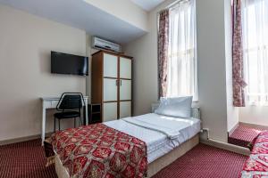 Postel nebo postele na pokoji v ubytování OttomanZade