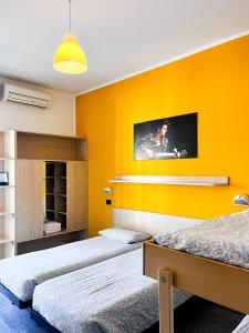 A bed or beds in a room at Hotel Morfeo - Young People Hotels