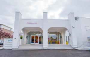 a white building with the entrance to a store at The Gallatin in Nashville
