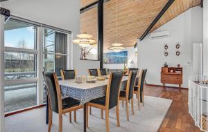 a dining room with a table and chairs at Stunning Home In Allingbro With 3 Bedrooms And Wifi in Allingåbro