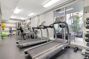 a gym with treadmills and elliptical machines at Roami at Habitat Brickell in Miami