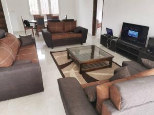 a living room with couches and a coffee table at CasaCanda king size in Somone