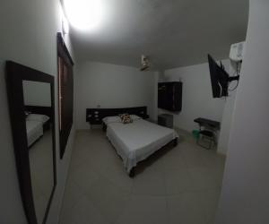Postel nebo postele na pokoji v ubytování HOTEL SAN ADOLFO